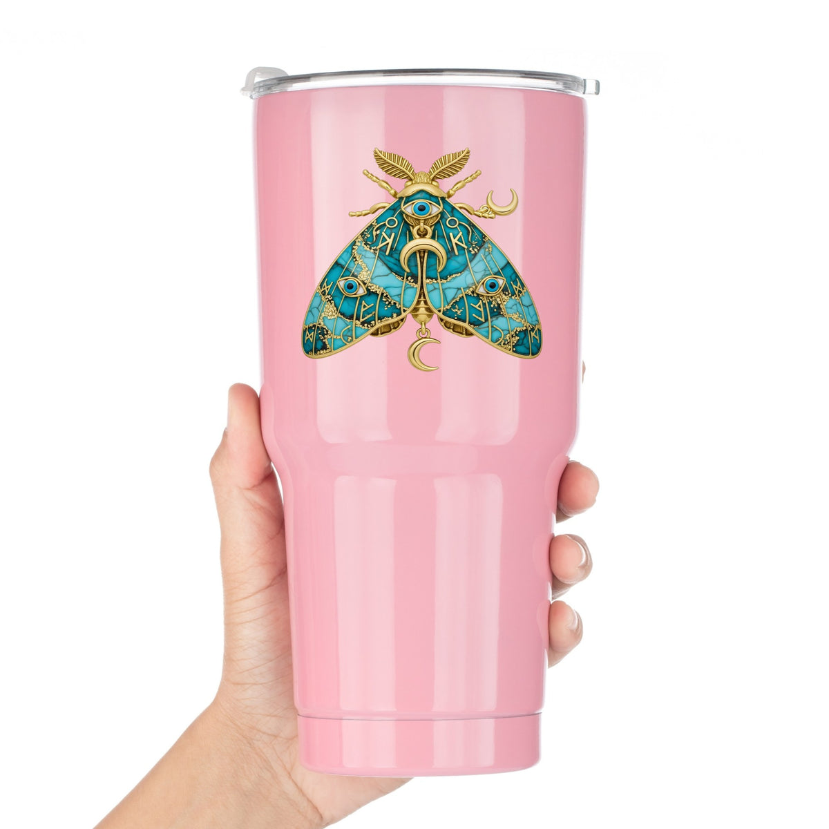 Teal Evil Eye Moth UV DTF sticker applied to a pink tumbler held against a white background