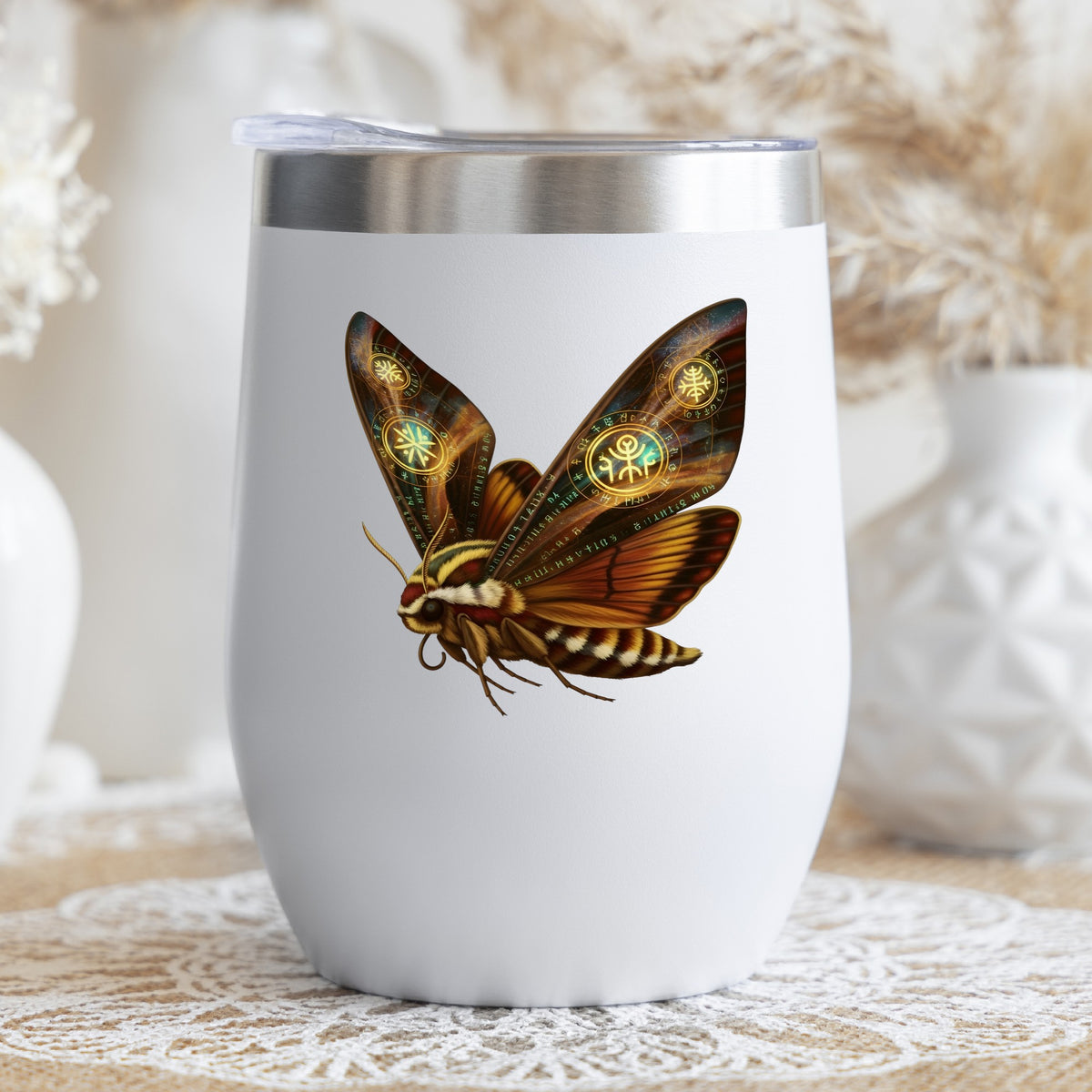 Brown Hawk Moth Glowing Runes UV DTF sticker applied to a white stemless tumbler with a lid