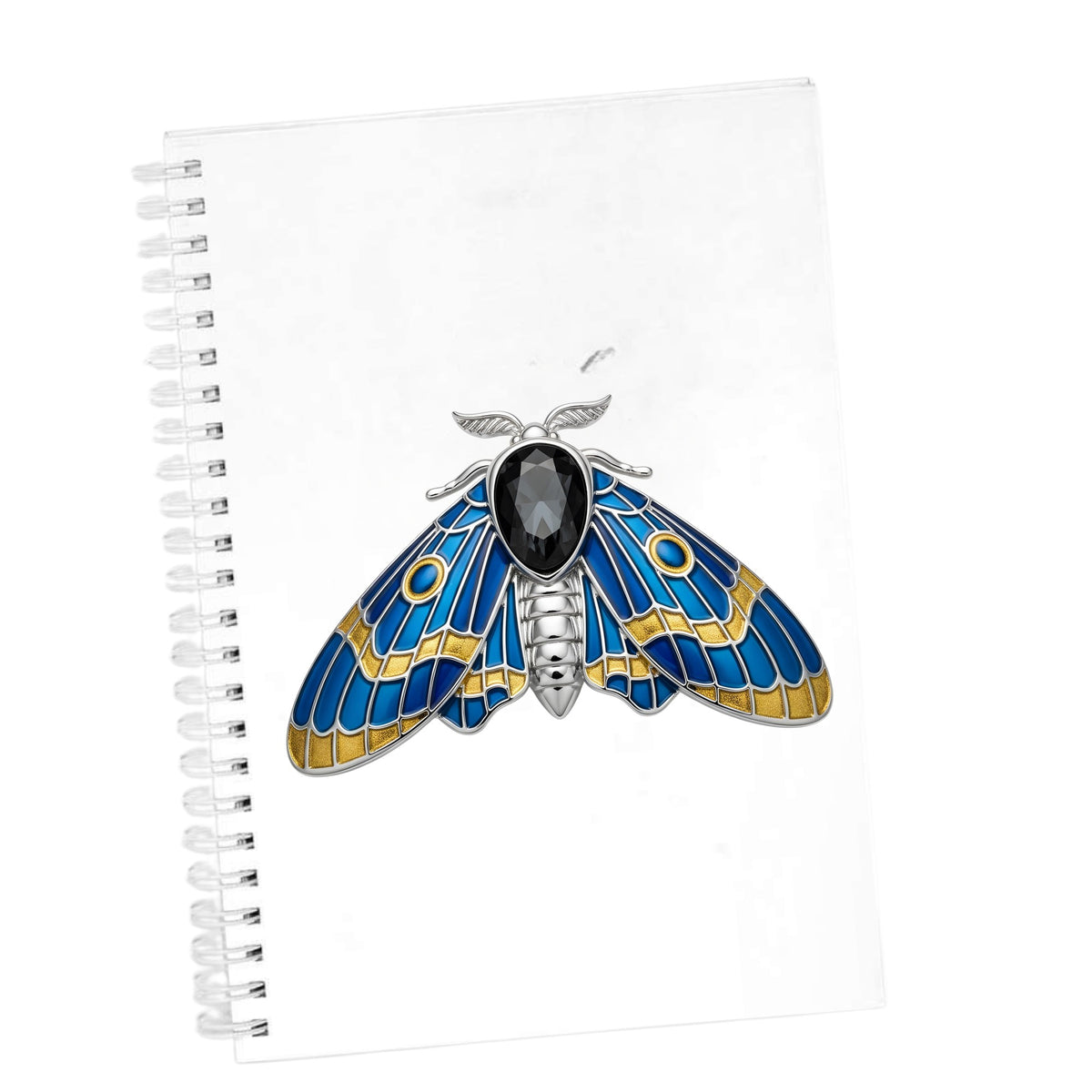 Silver Blue Enamel Moth UV DTF sticker applied to the cover of a white spiral journal