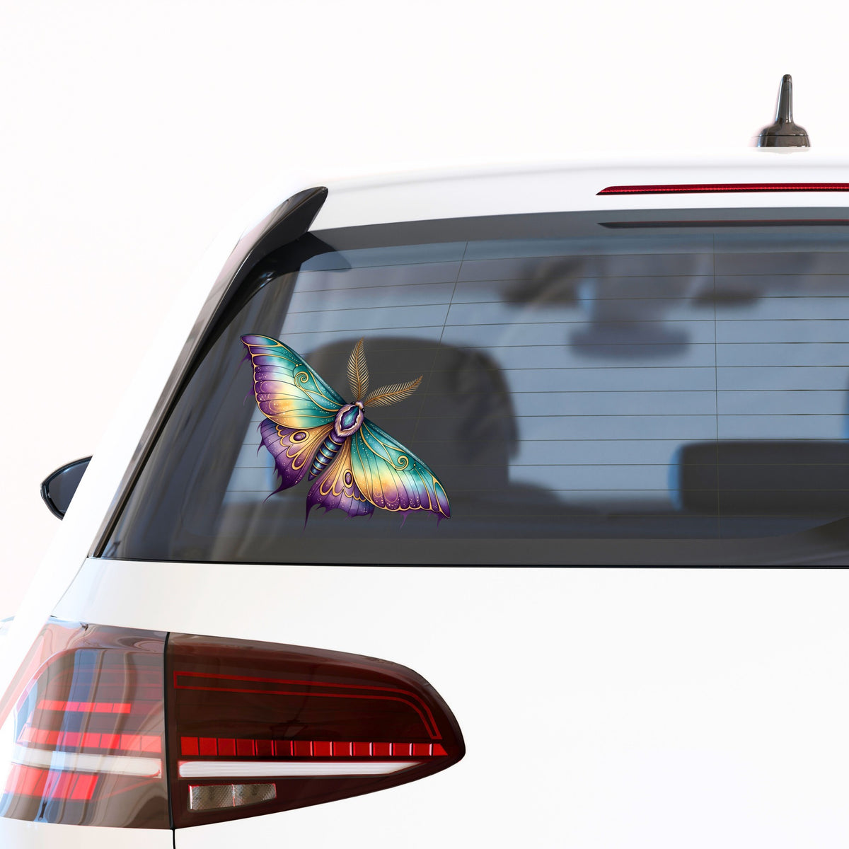 Watercolor Purple Teal Moth UV DTF sticker applied to the rear window of a white car