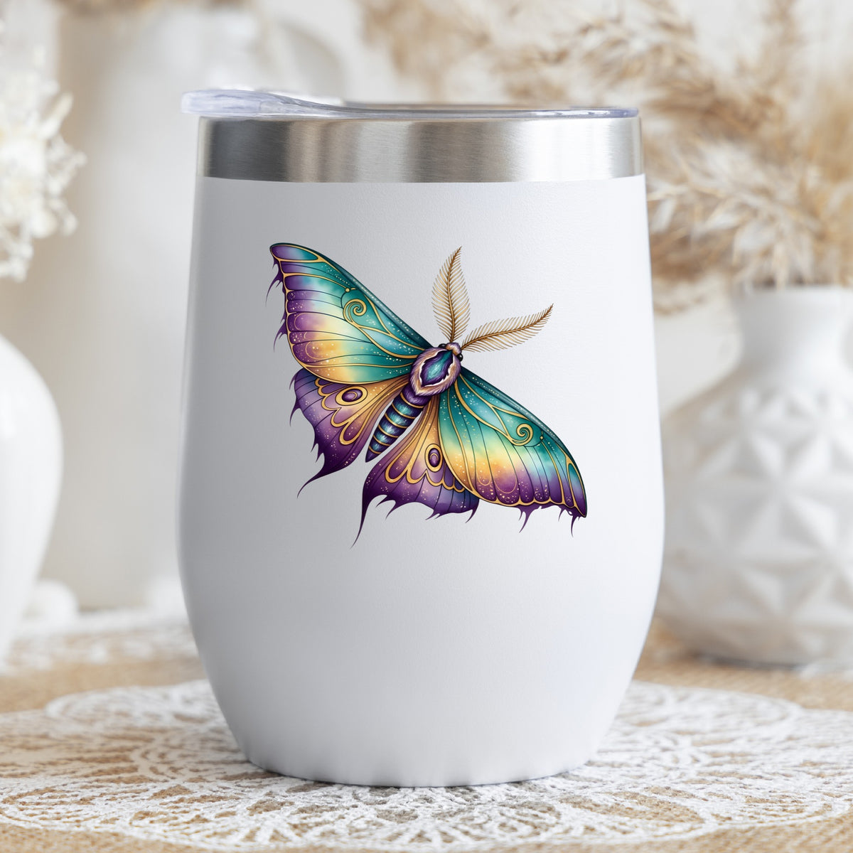 Watercolor Purple Teal Moth UV DTF sticker applied to a white stemless tumbler with a lid