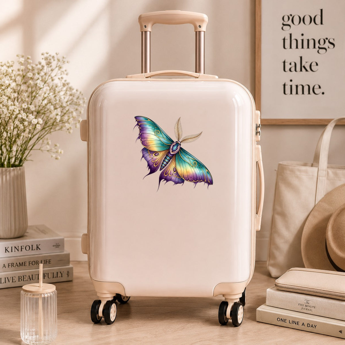 Watercolor Purple Teal Moth UV DTF sticker applied to a cream carry-on suitcase