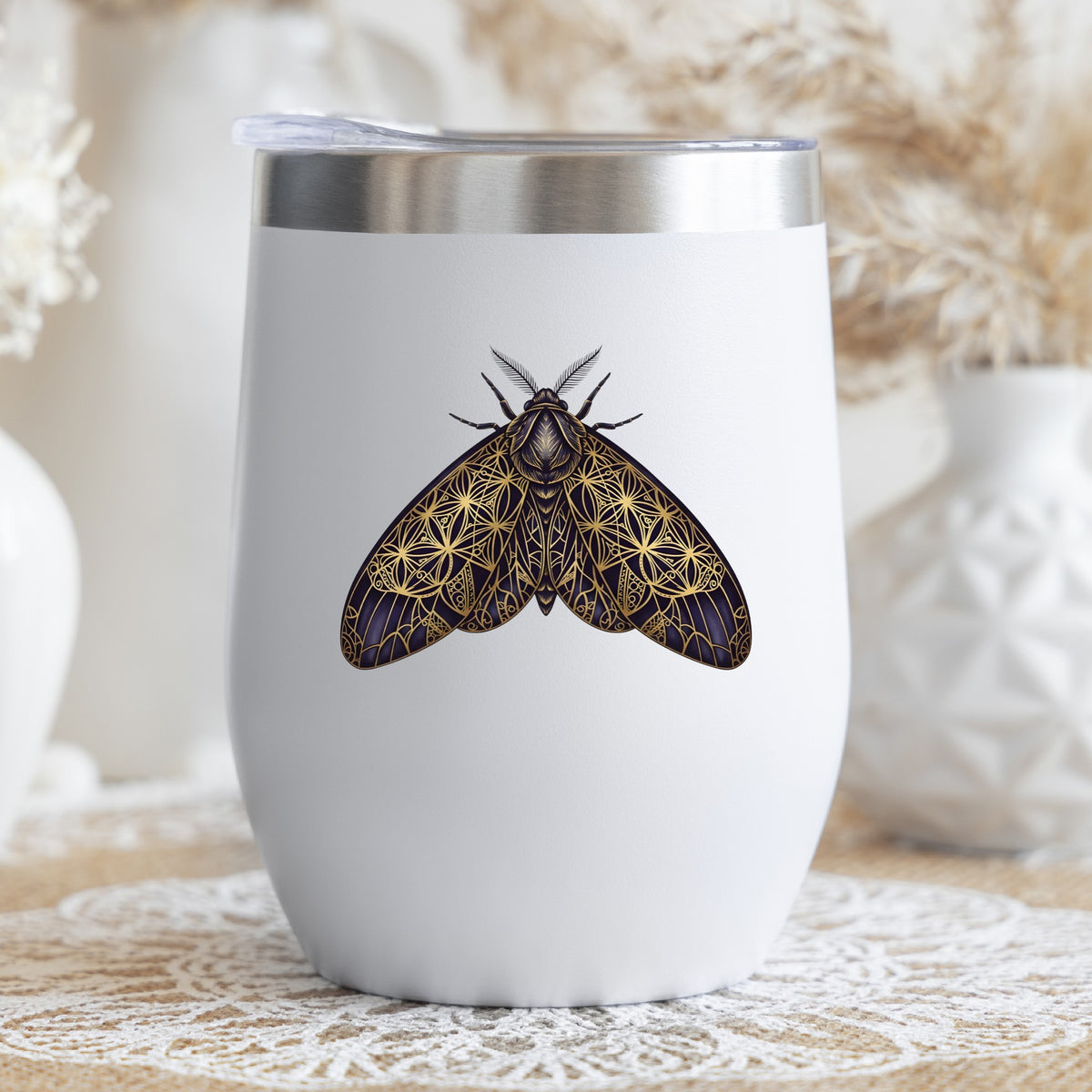 Sacred Geometry Moth UV DTF sticker applied to a white stemless tumbler with a lid