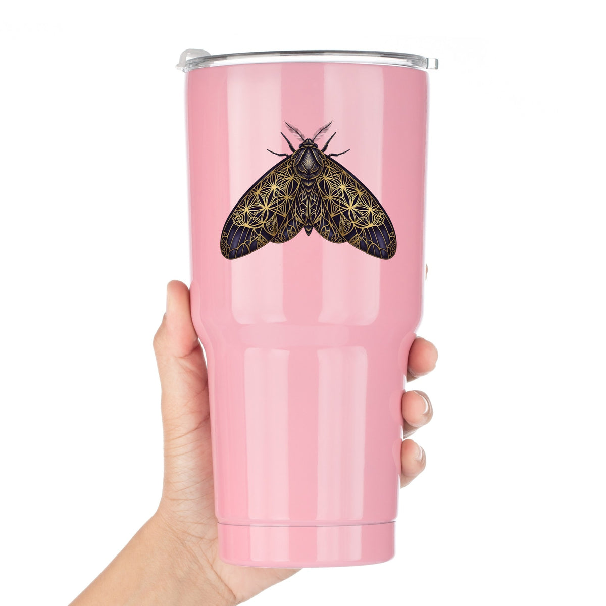 Sacred Geometry Moth UV DTF sticker applied to a pink tumbler held against a white background