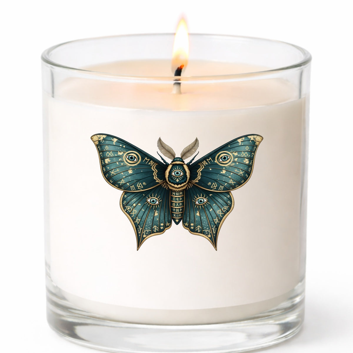 Teal Rune Moth All Seeing Eye UV DTF sticker applied to a white candle in a clear glass jar