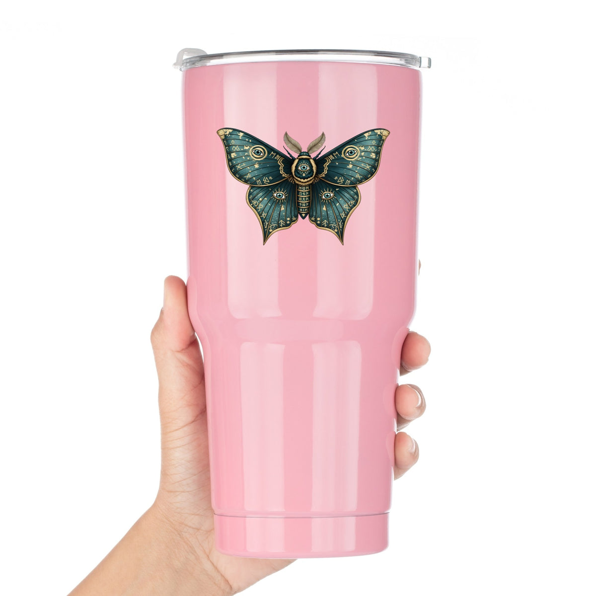Teal Rune Moth All Seeing Eye UV DTF sticker applied to a pink tumbler held against a white background