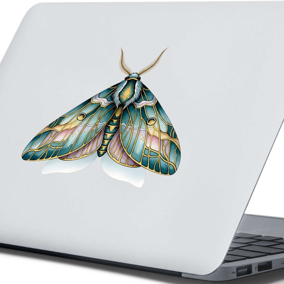 Pastel Teal Pink Moth UV DTF sticker applied to the lid of a silver laptop