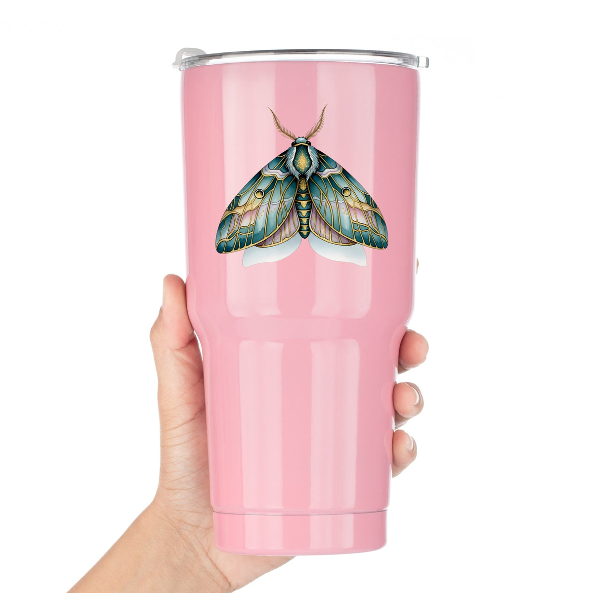 Pastel Teal Pink Moth UV DTF sticker applied to a pink tumbler held against a white background