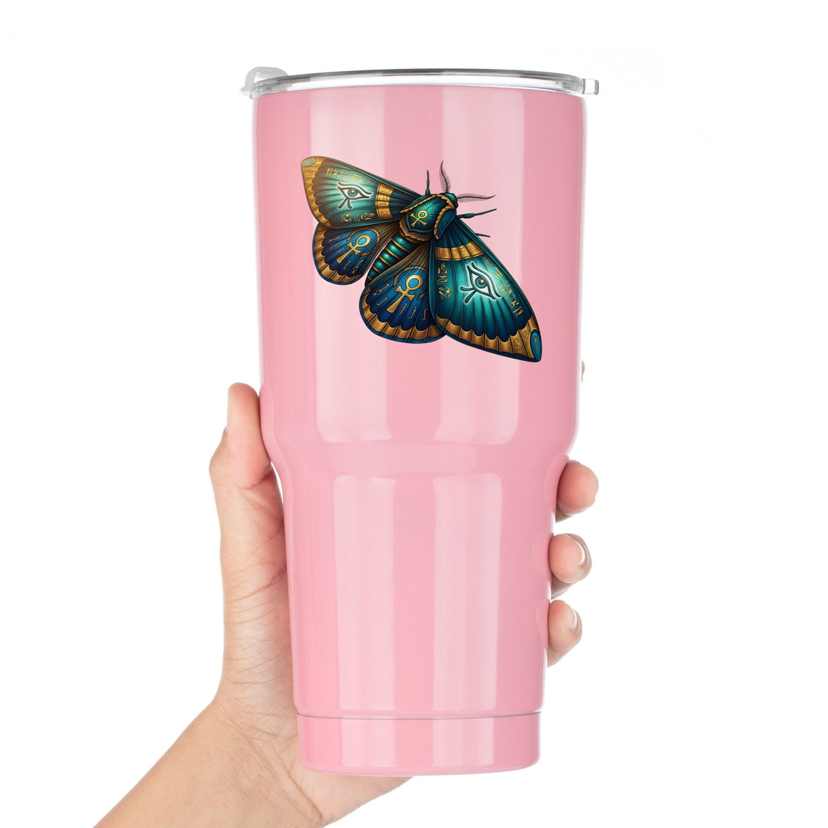 Egyptian Eye Of Horus Moth UV DTF sticker applied to a pink tumbler held against a white background