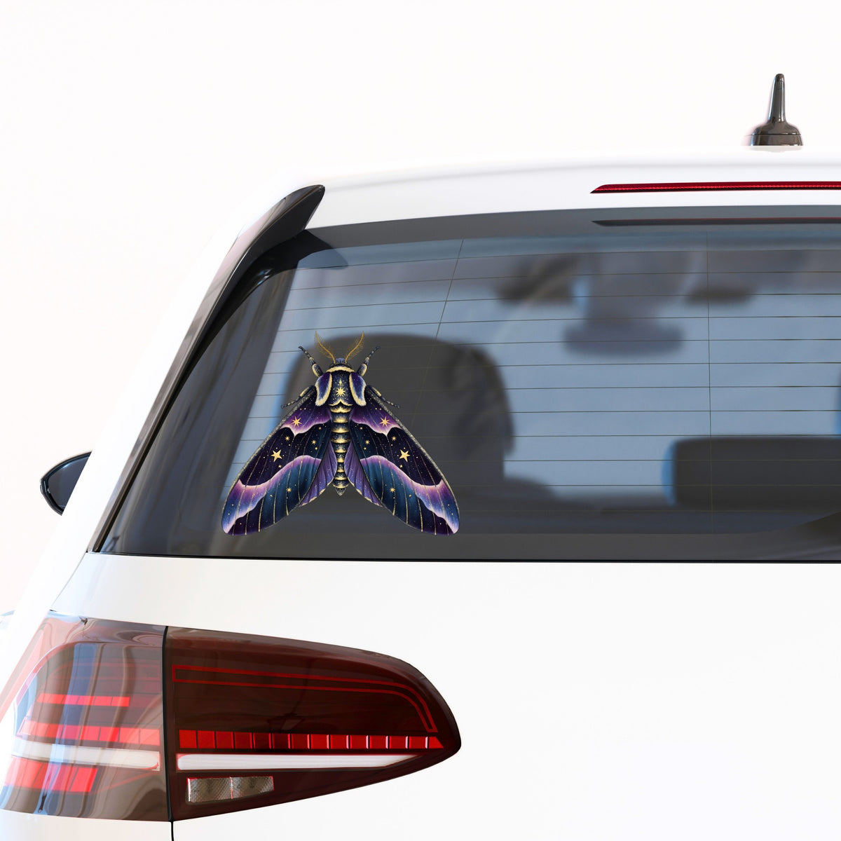 Night Sky Purple Moth UV DTF sticker applied to the rear window of a white car