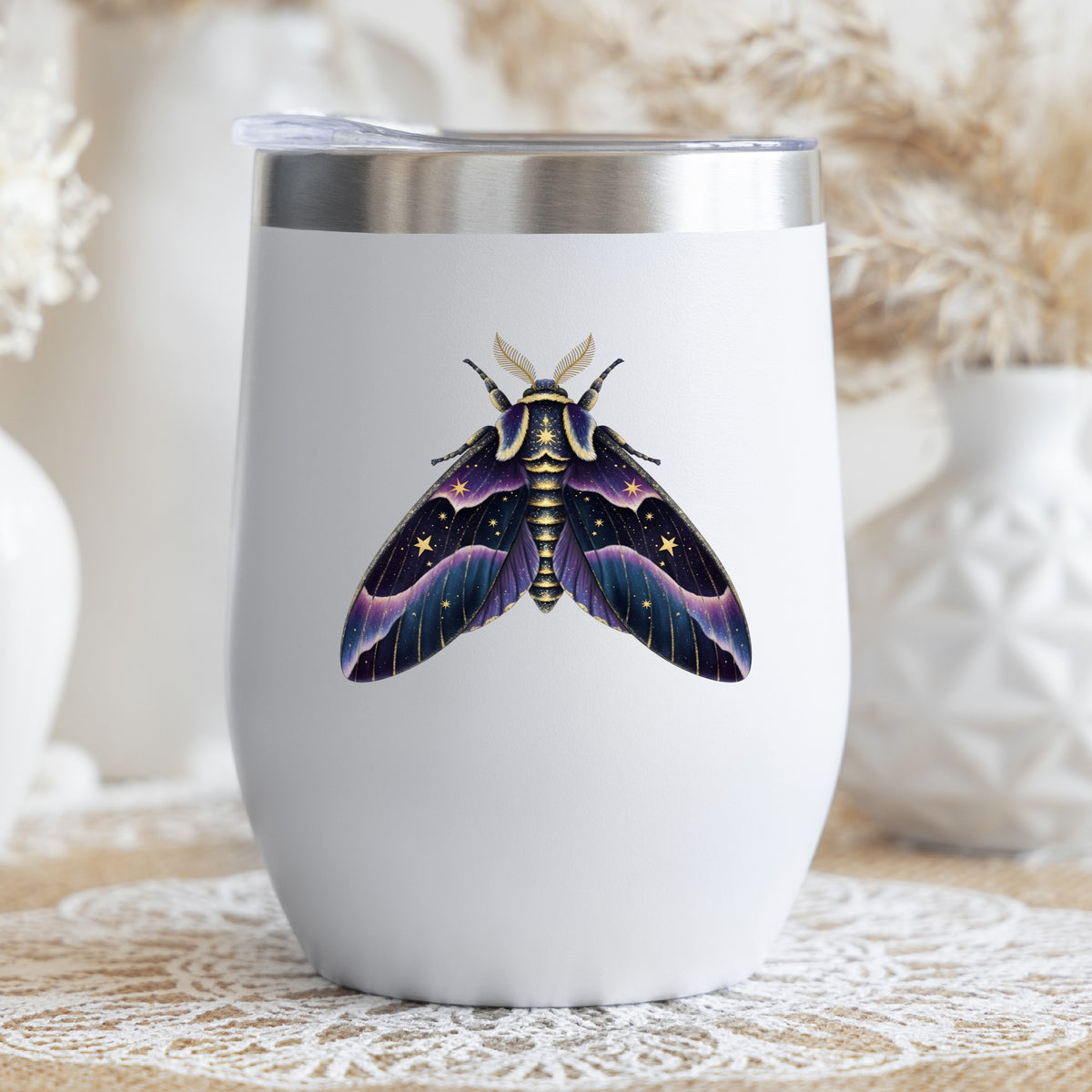 Night Sky Purple Moth UV DTF sticker applied to a white stemless tumbler with a lid