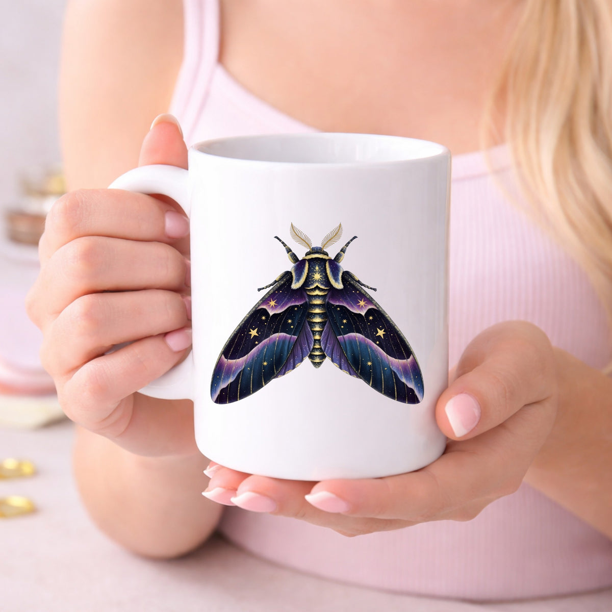 Night Sky Purple Moth UV DTF sticker applied to a white coffee mug held in both hands