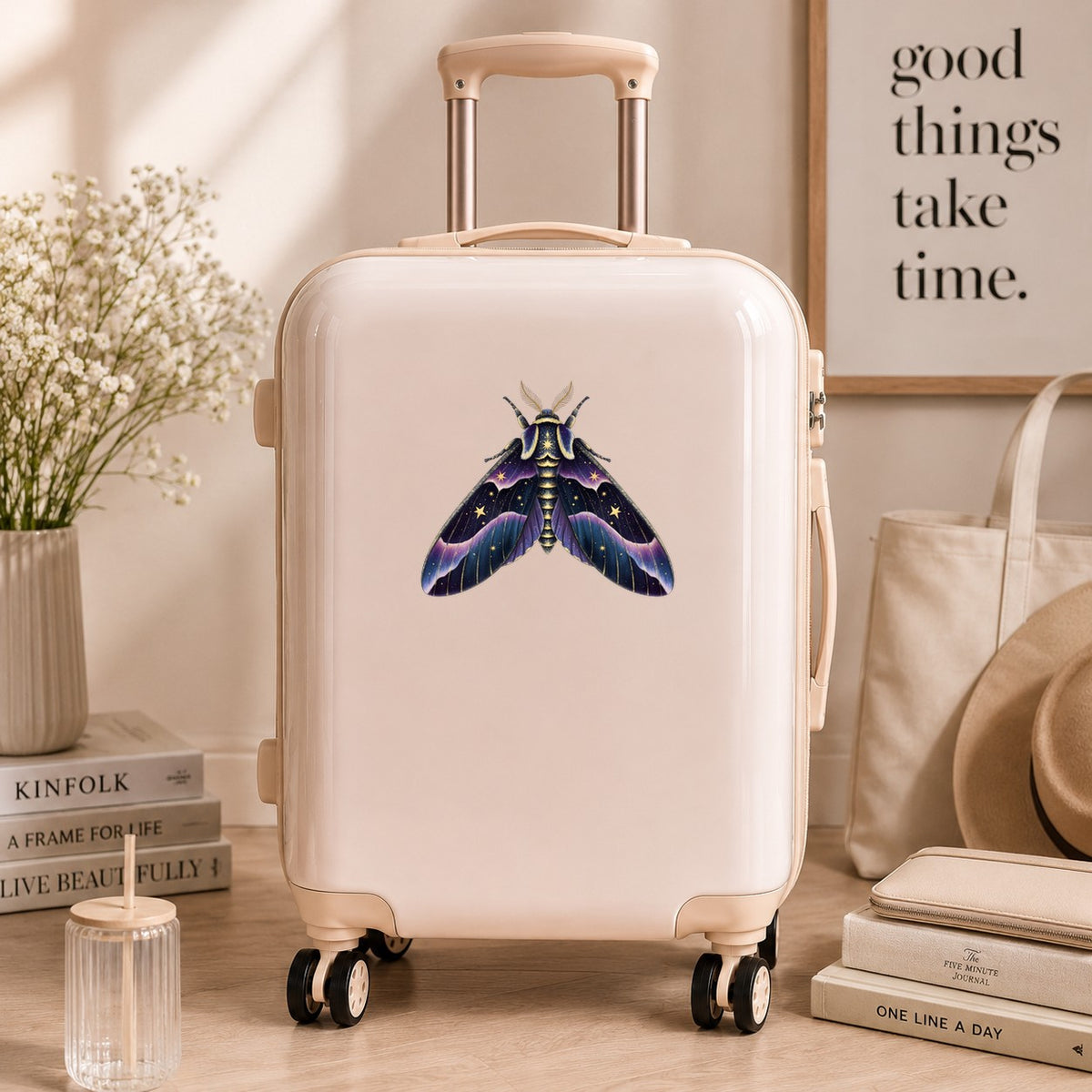 Night Sky Purple Moth UV DTF sticker applied to a cream carry-on suitcase