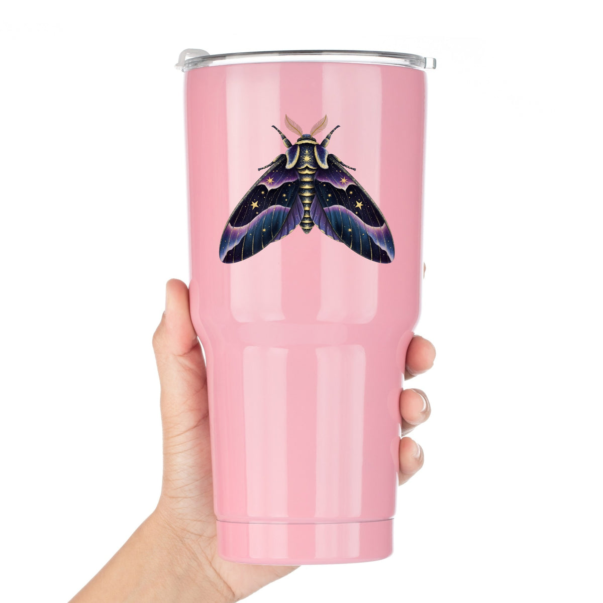 Night Sky Purple Moth UV DTF sticker applied to a pink tumbler held against a white background