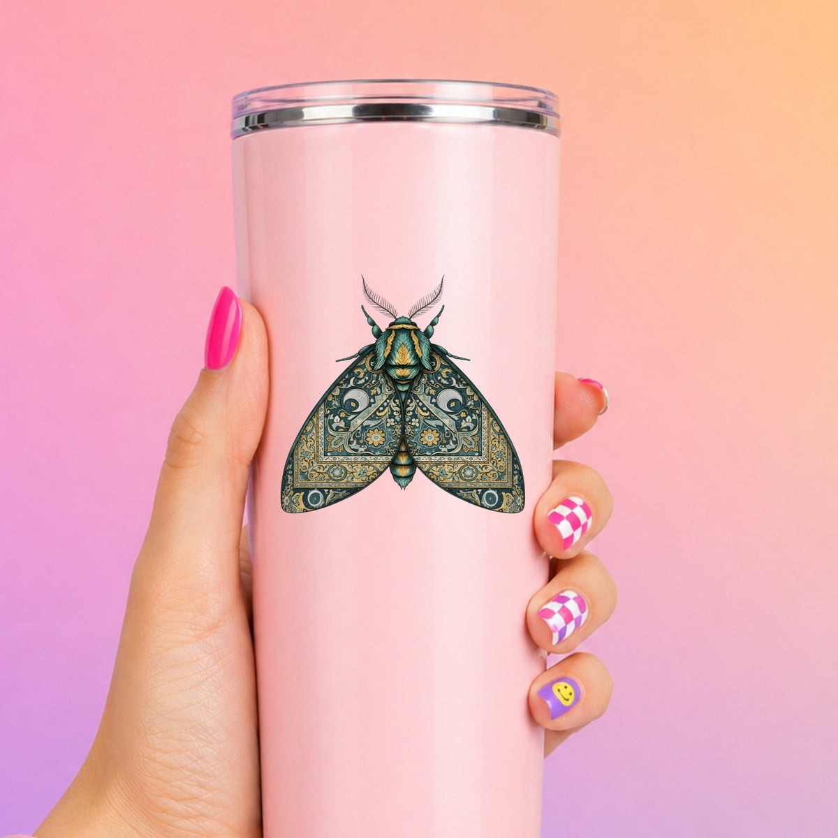 Green Damask Moth UV DTF sticker applied to a tall pink tumbler on a pink and orange background