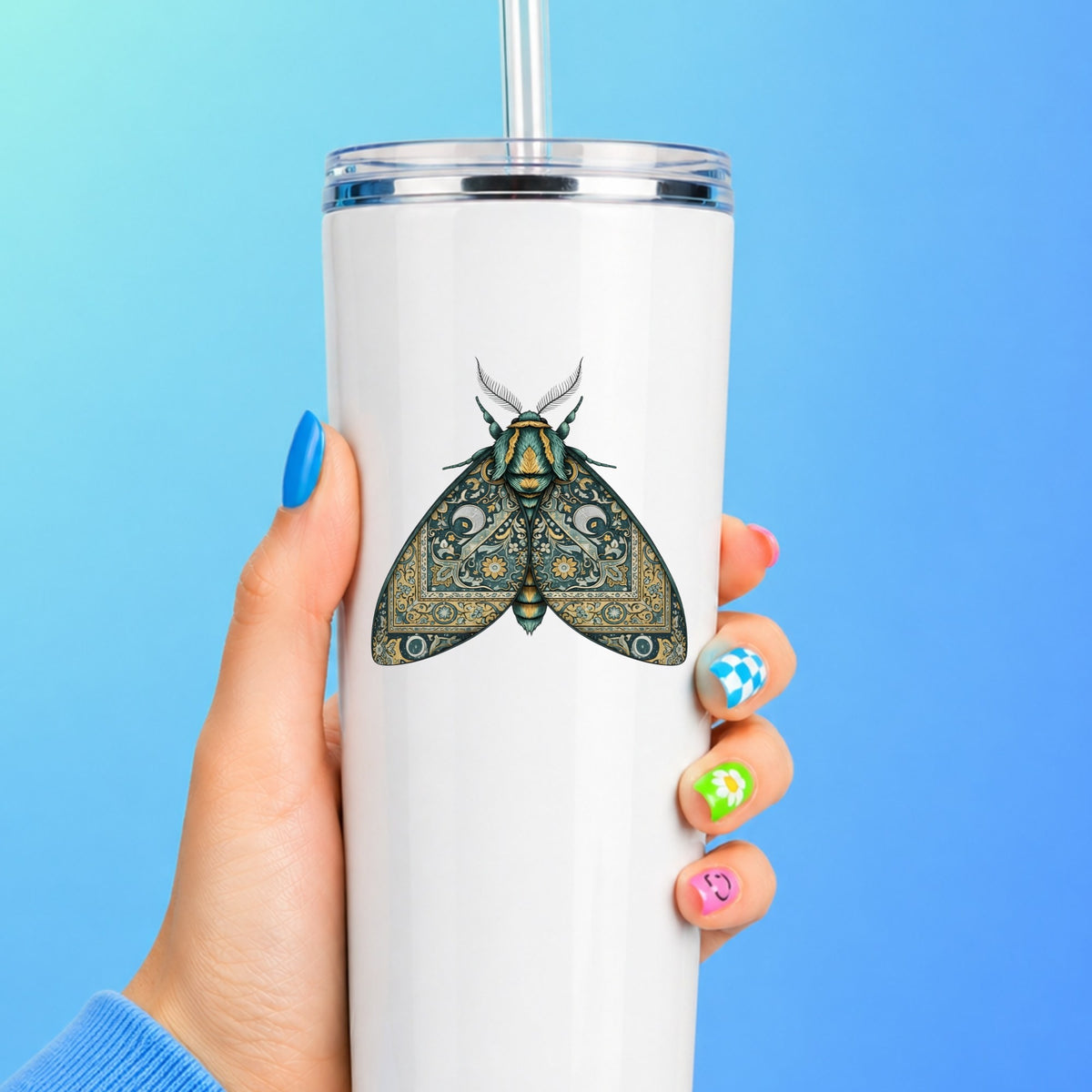 Green Damask Moth UV DTF sticker applied to a white straw tumbler on a blue background