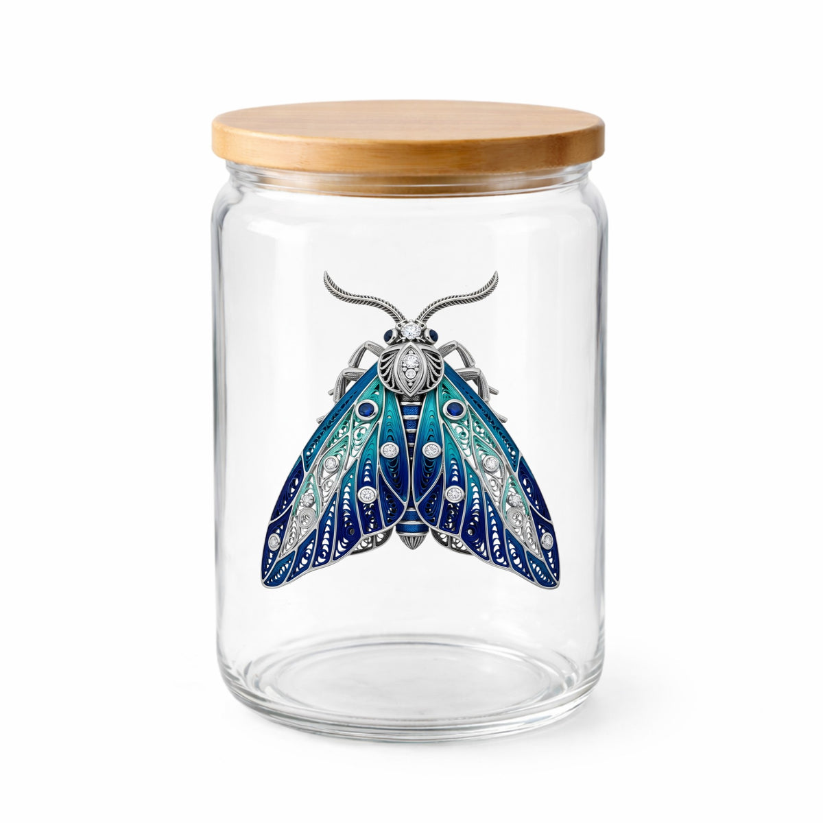 Silver Filigree Blue Moth UV DTF sticker applied to a clear glass jar with a wooden lid