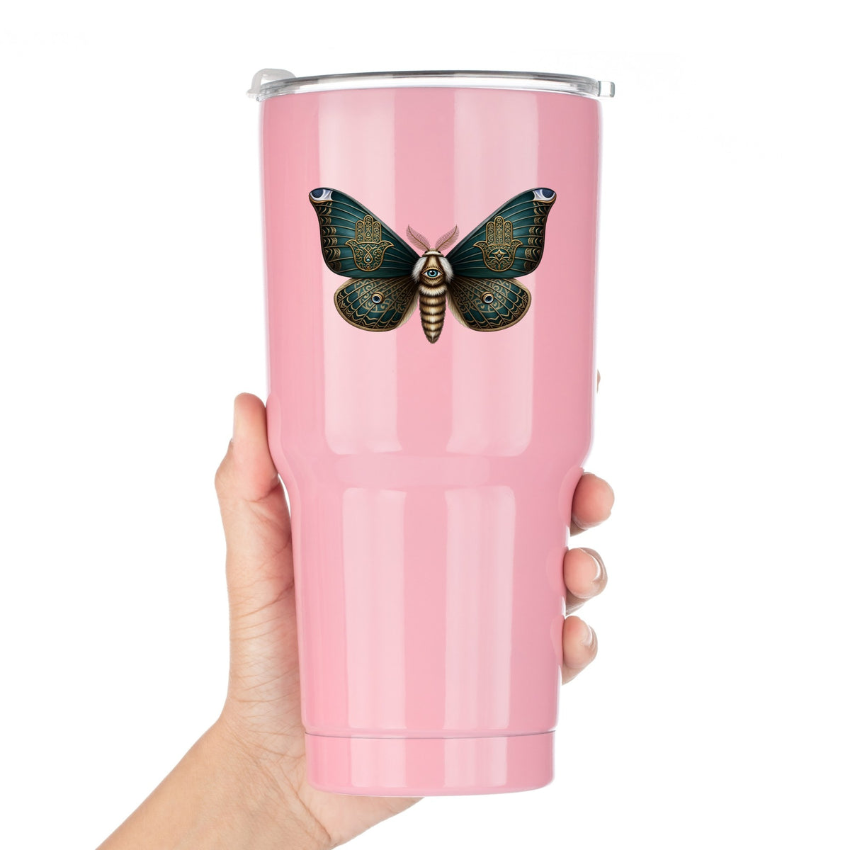 Hamsa Hand Moth UV DTF sticker applied to a pink tumbler held against a white background