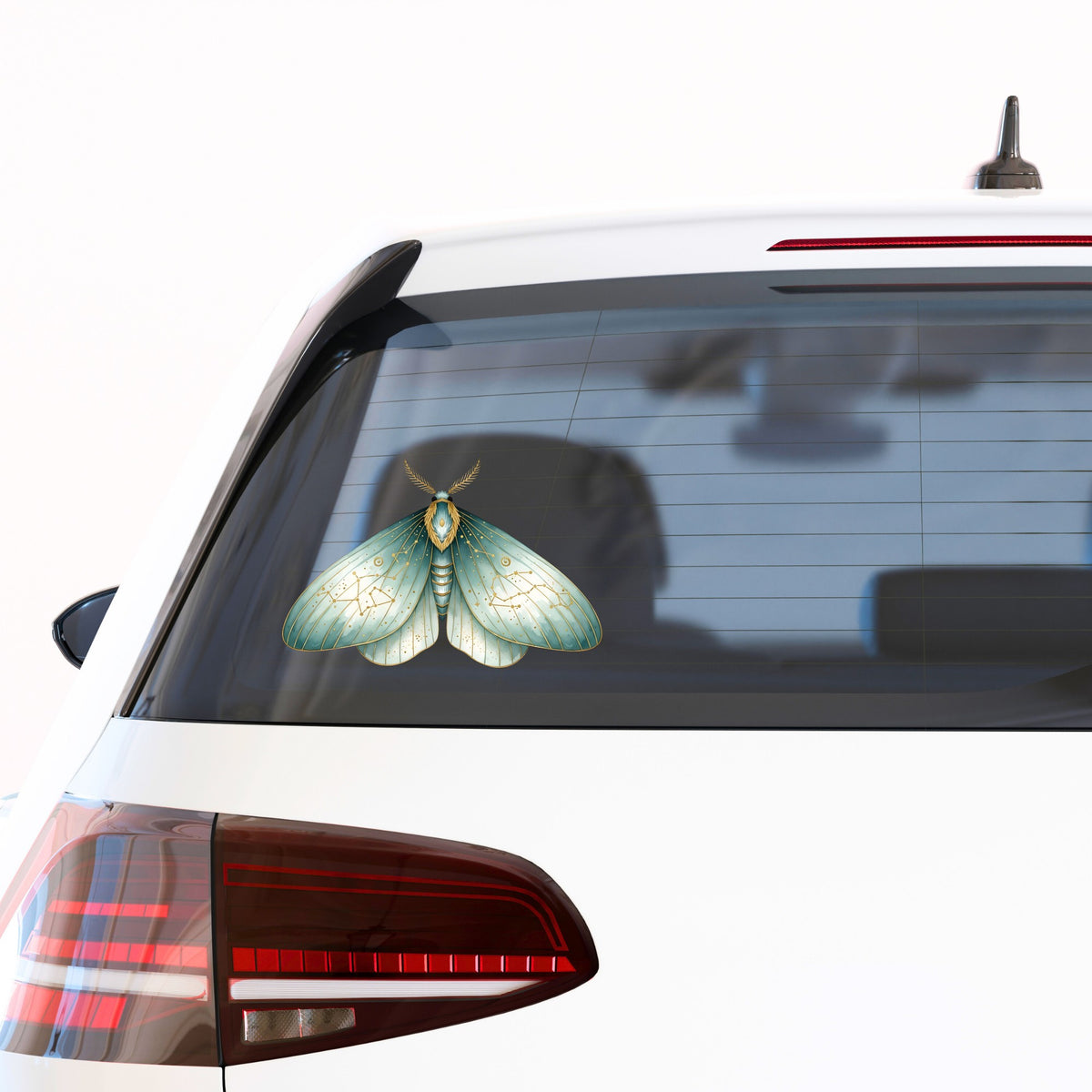 Mint Watercolor Moth UV DTF sticker applied to the rear window of a white car