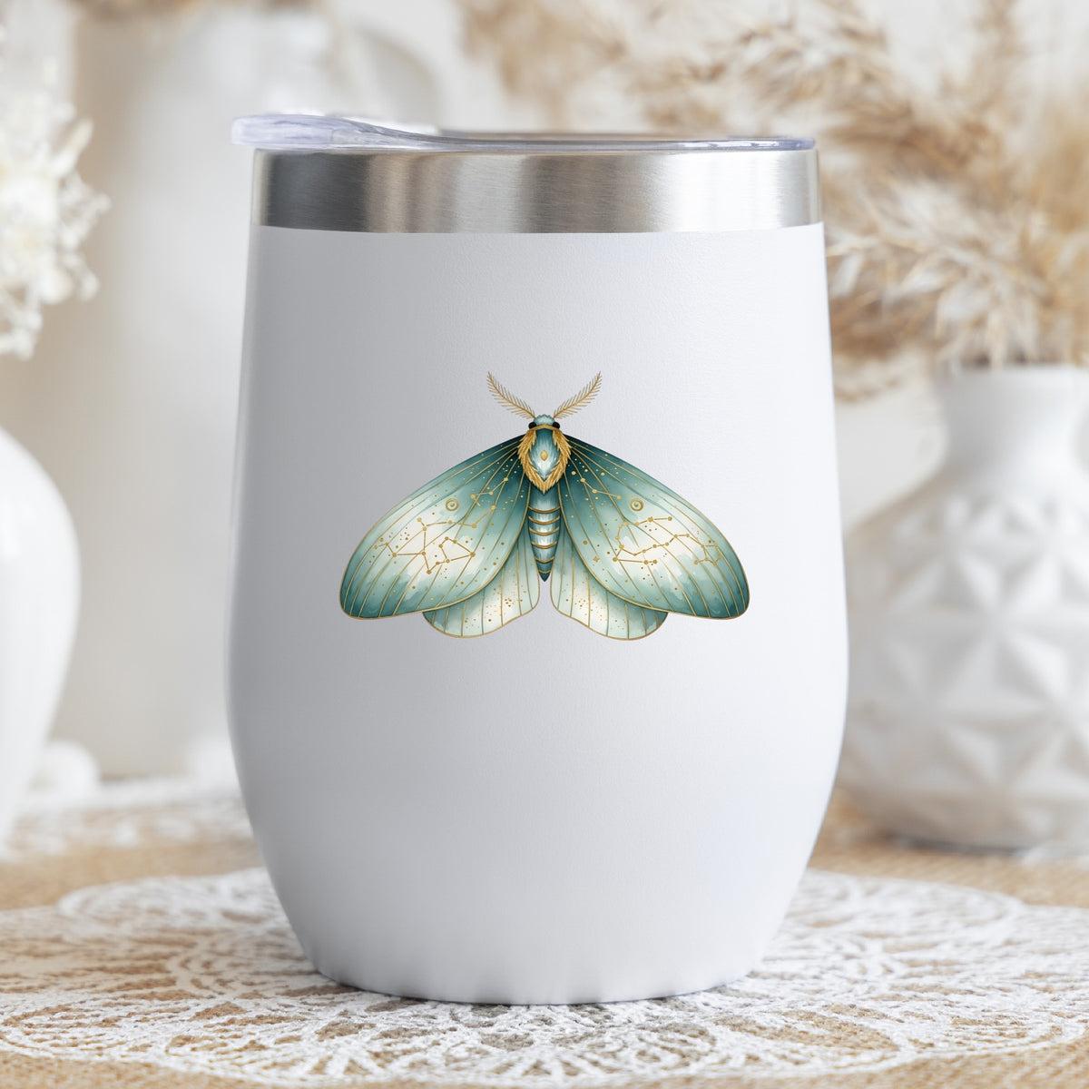 Mint Watercolor Moth UV DTF sticker applied to a white stemless tumbler with a lid