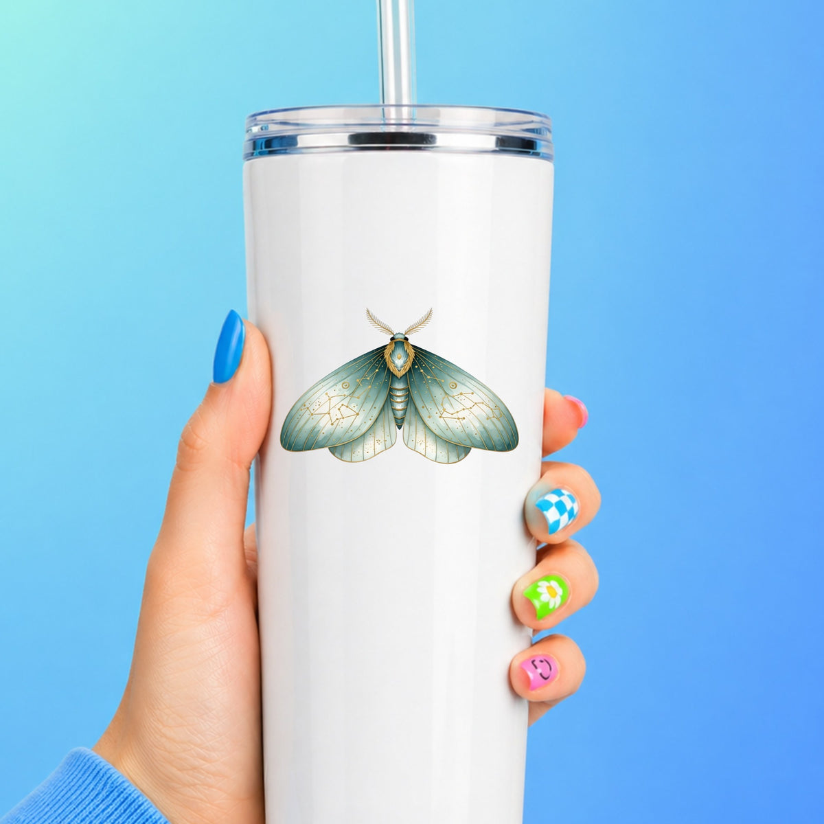 Mint Watercolor Moth UV DTF sticker applied to a white straw tumbler on a blue background