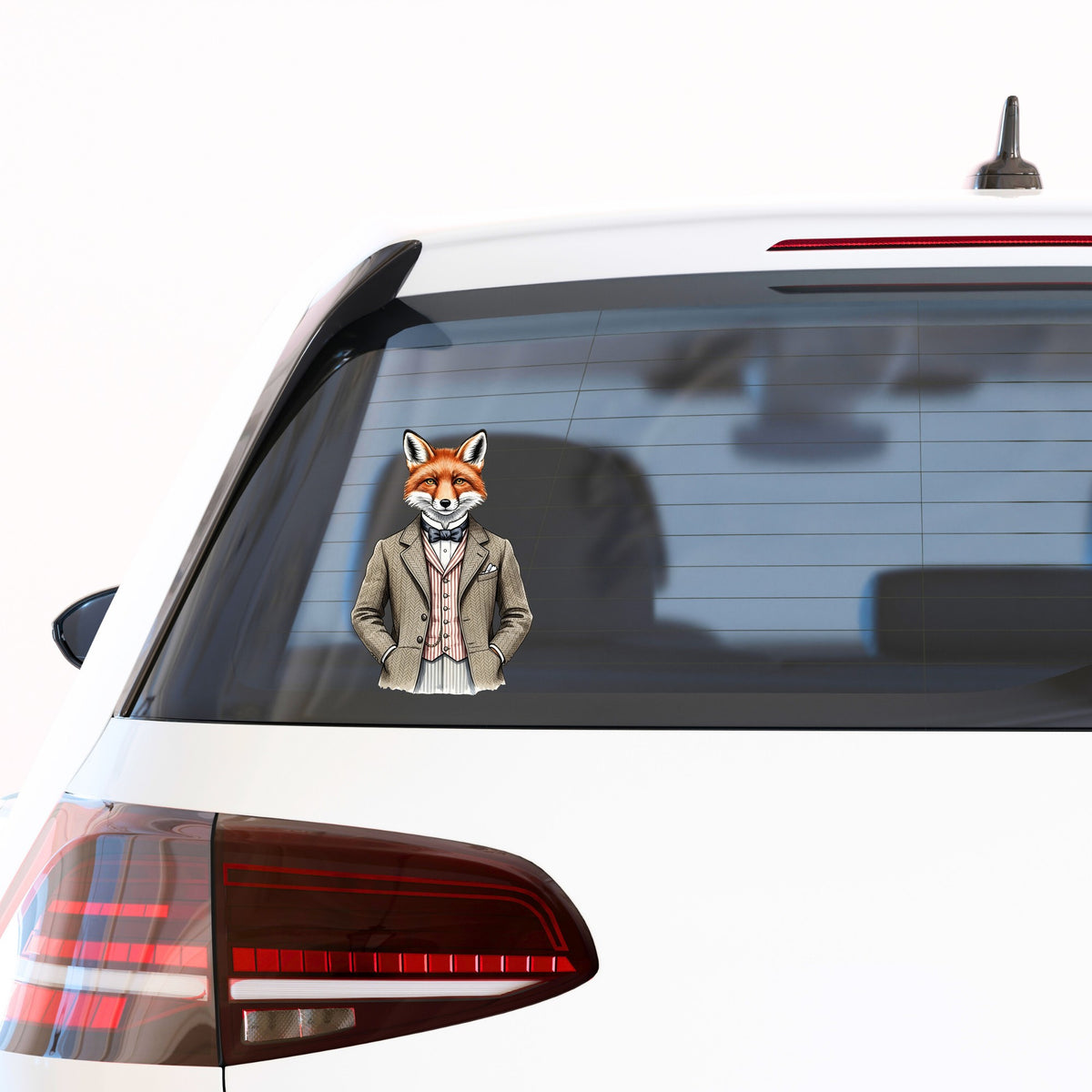 Dapper Fox Tweed Suit UV DTF sticker applied to the rear window of a white car