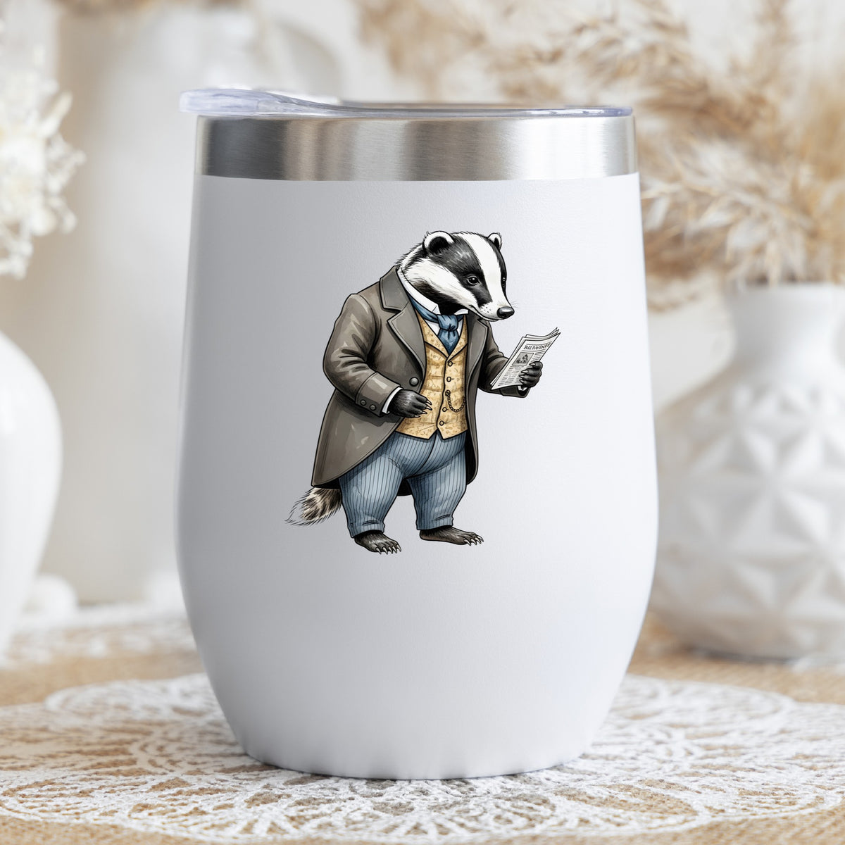 Badger Reading Newspaper UV DTF sticker applied to a white stemless tumbler with a lid