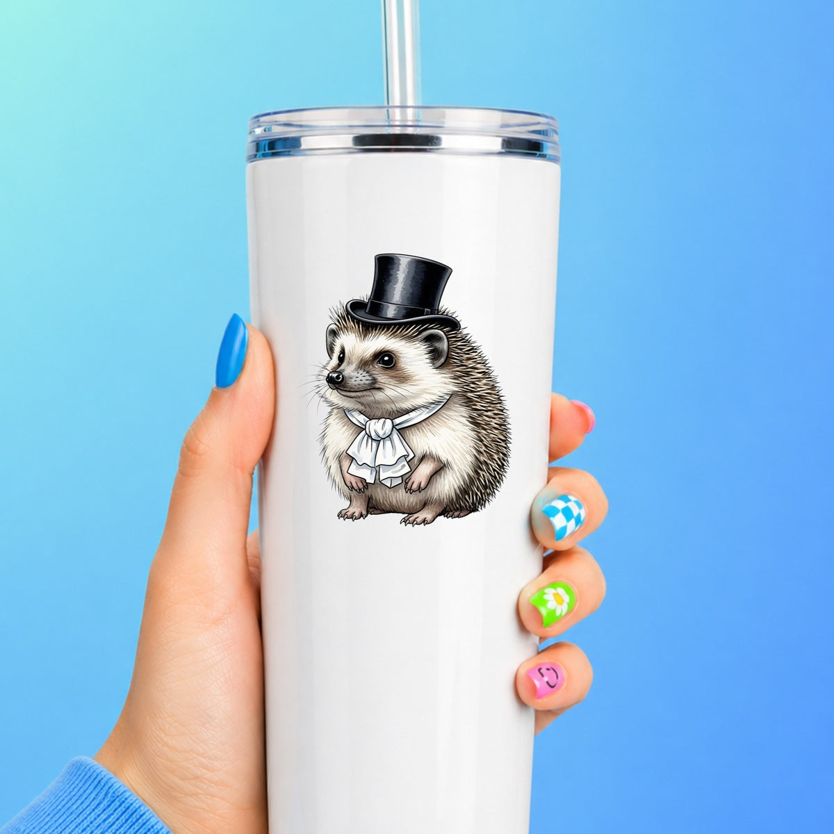 Hedgehog In Top Hat UV DTF sticker applied to a white straw tumbler on a blue background