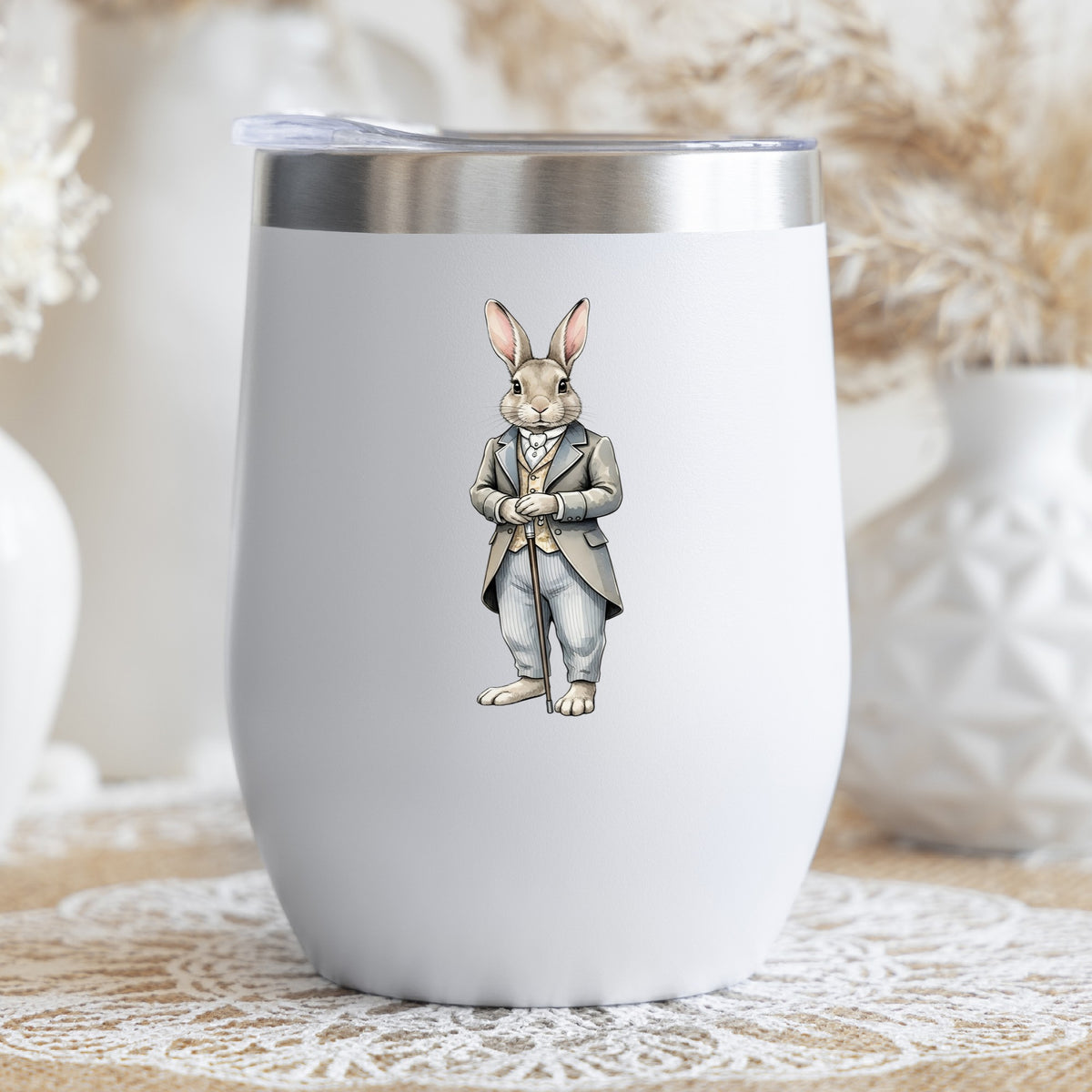 Gray Bunny Victorian Suit Cane UV DTF sticker applied to a white stemless tumbler with a lid