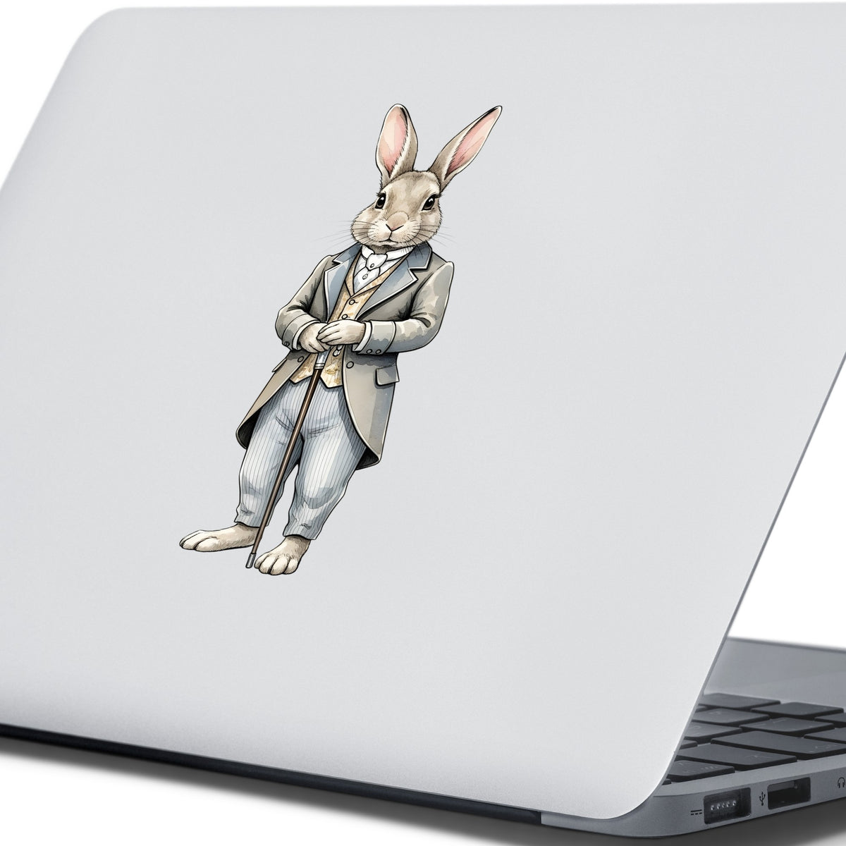 Gray Bunny Victorian Suit Cane UV DTF sticker applied to the lid of a silver laptop