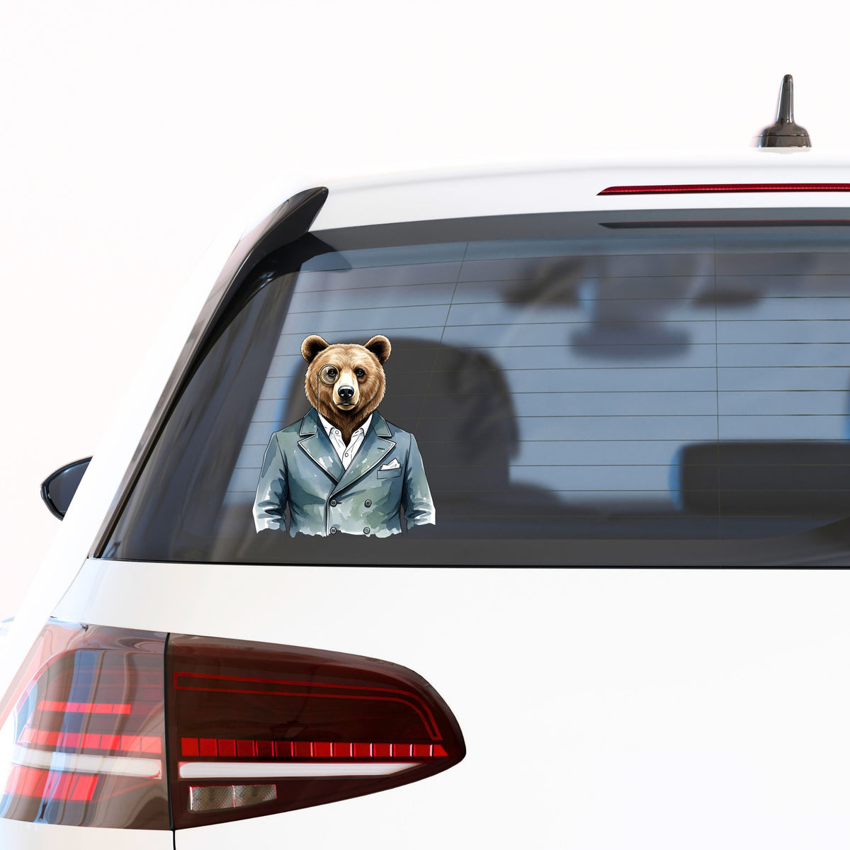 Bear With Monocle Blue Suit UV DTF sticker applied to the rear window of a white car
