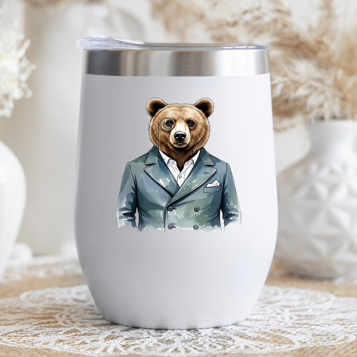 Bear With Monocle Blue Suit UV DTF sticker applied to a white stemless tumbler with a lid