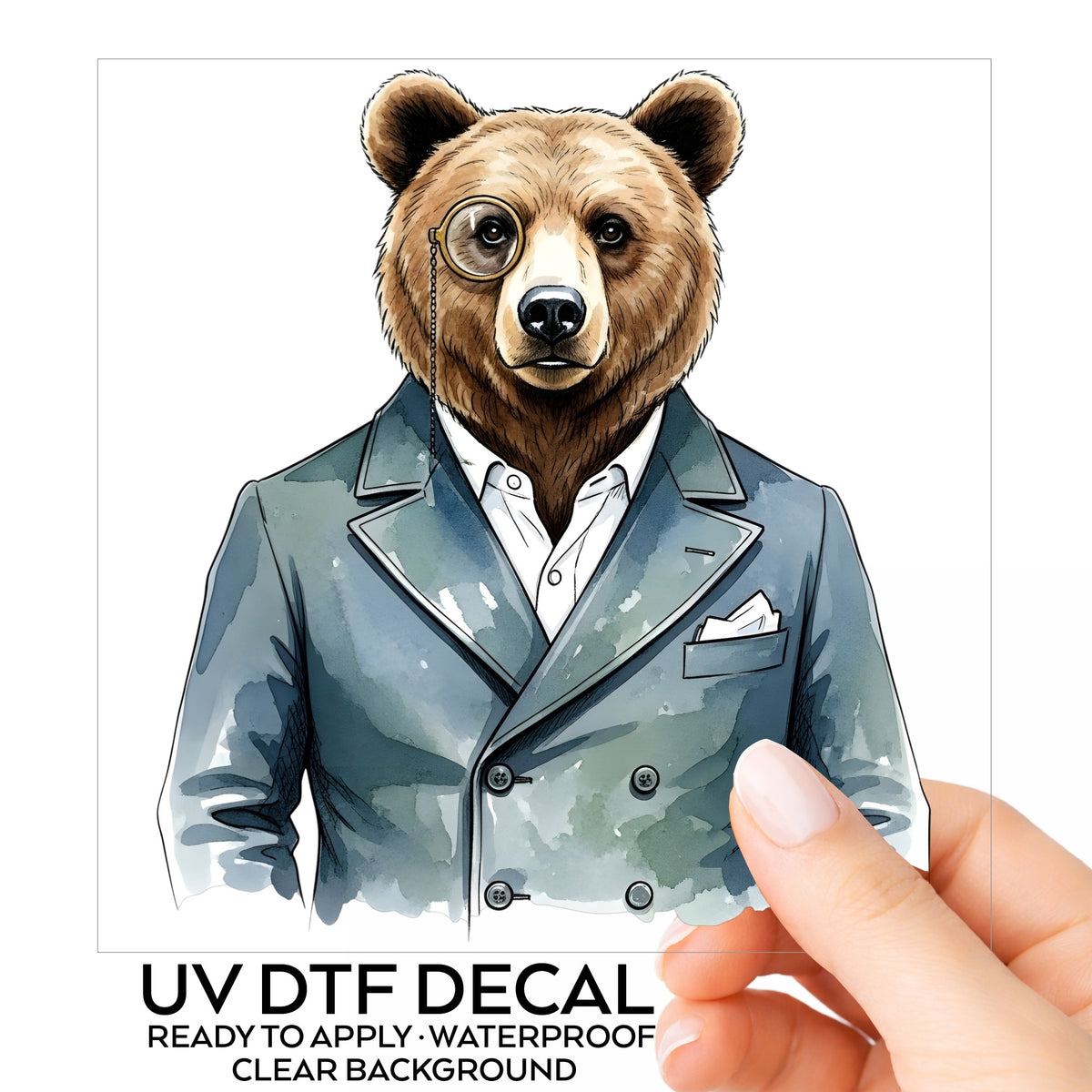 Bear With Monocle Blue Suit UV DTF sticker on its backing card, held in hand