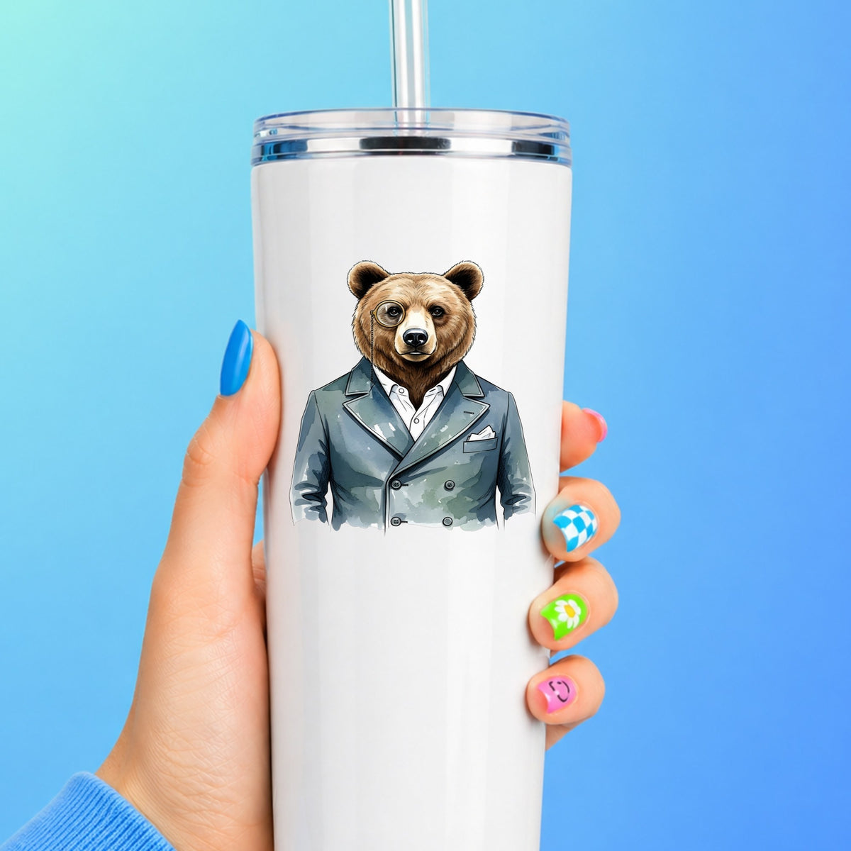 Bear With Monocle Blue Suit UV DTF sticker applied to a white straw tumbler on a blue background