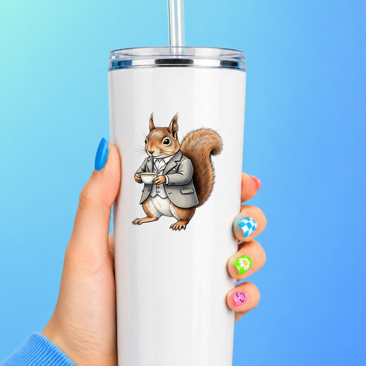 Red Squirrel Holding Teacup UV DTF sticker applied to a white straw tumbler on a blue background