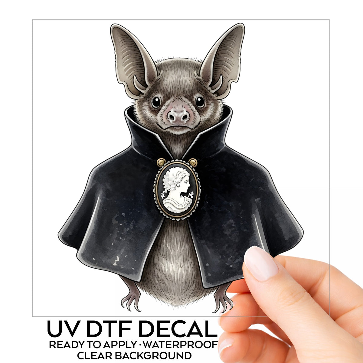 Bat In Black Cape Cameo UV DTF sticker on its backing card, held in hand