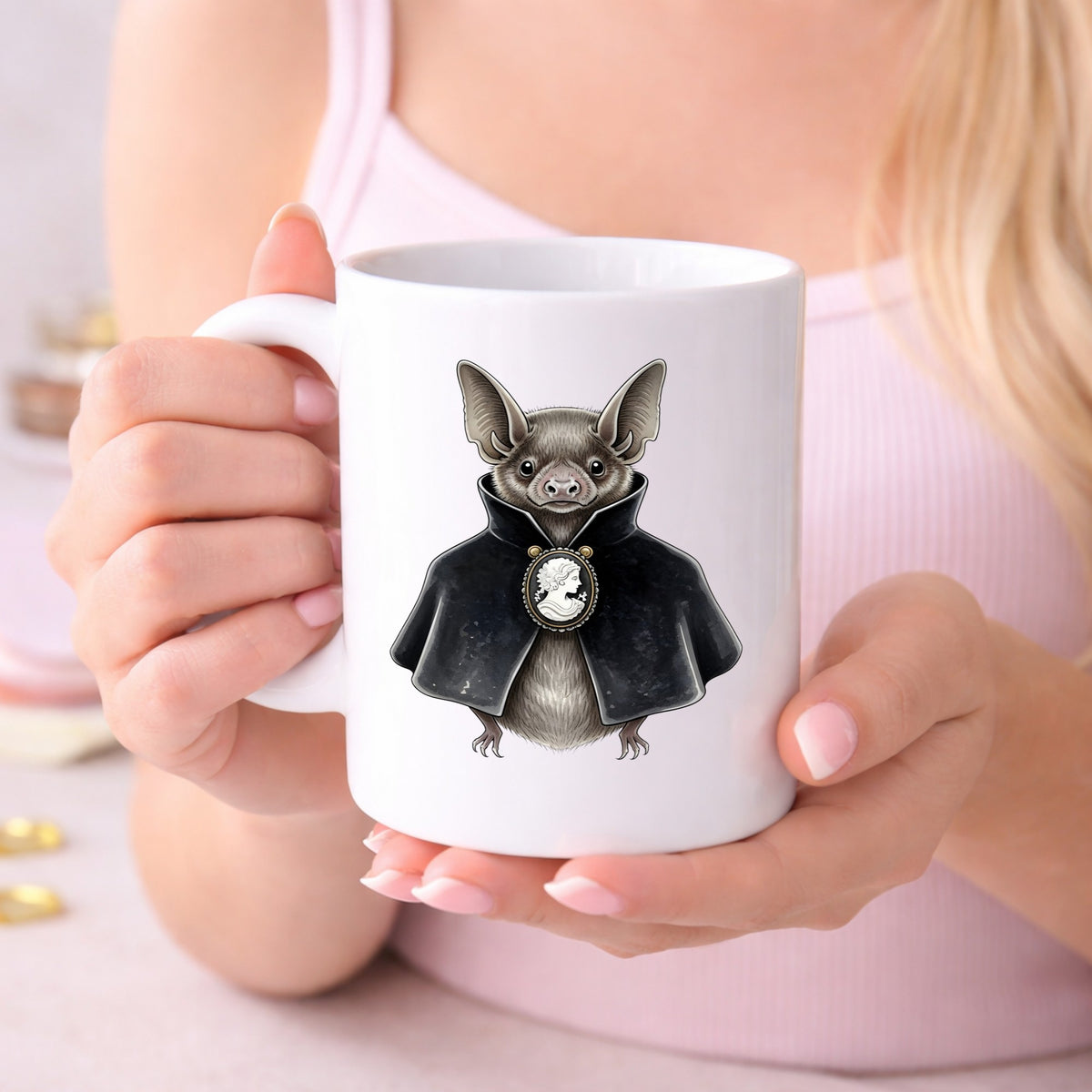 Bat In Black Cape Cameo UV DTF sticker applied to a white coffee mug held in both hands