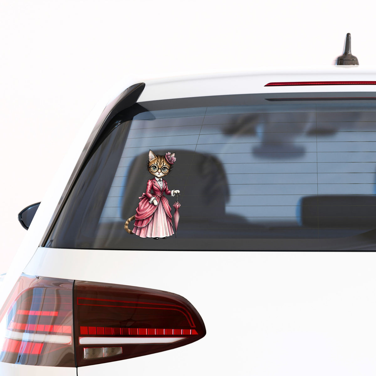 Tabby Cat Pink Victorian Dress UV DTF sticker applied to the rear window of a white car