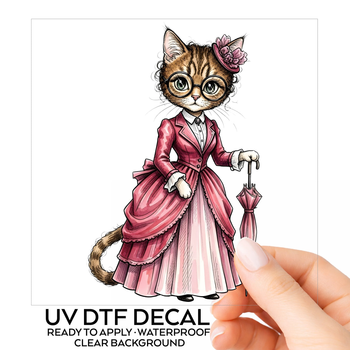 Tabby Cat Pink Victorian Dress UV DTF sticker on its backing card, held in hand