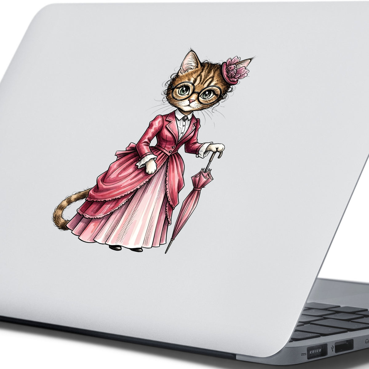 Tabby Cat Pink Victorian Dress UV DTF sticker applied to the lid of a silver laptop