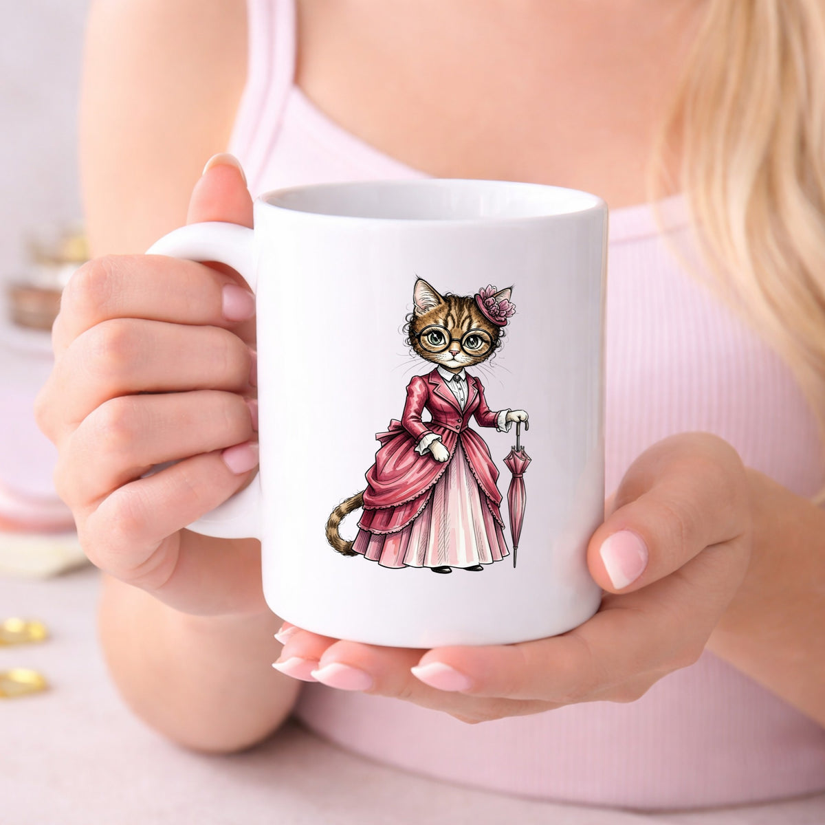 Tabby Cat Pink Victorian Dress UV DTF sticker applied to a white coffee mug held in both hands