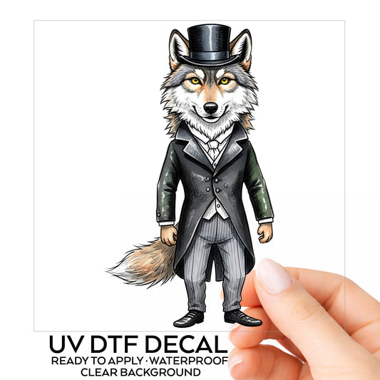 Gray Wolf Top Hat Tailcoat UV DTF sticker on its backing card, held in hand