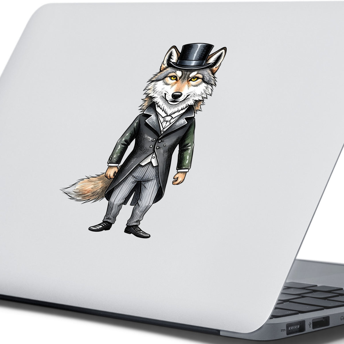Gray Wolf Top Hat Tailcoat UV DTF sticker applied to the lid of a silver laptop