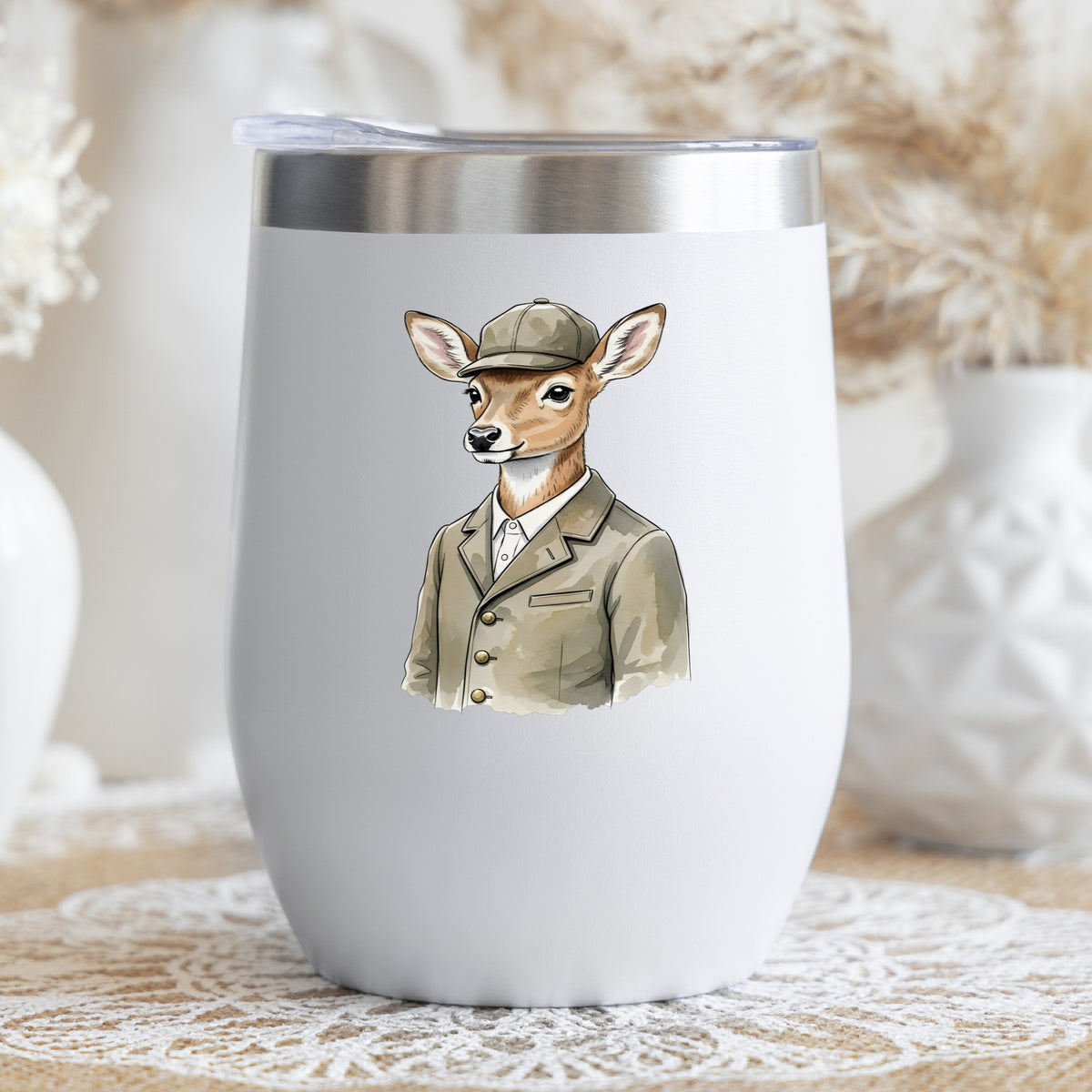 Deer In Tweed Cap Jacket UV DTF sticker applied to a white stemless tumbler with a lid