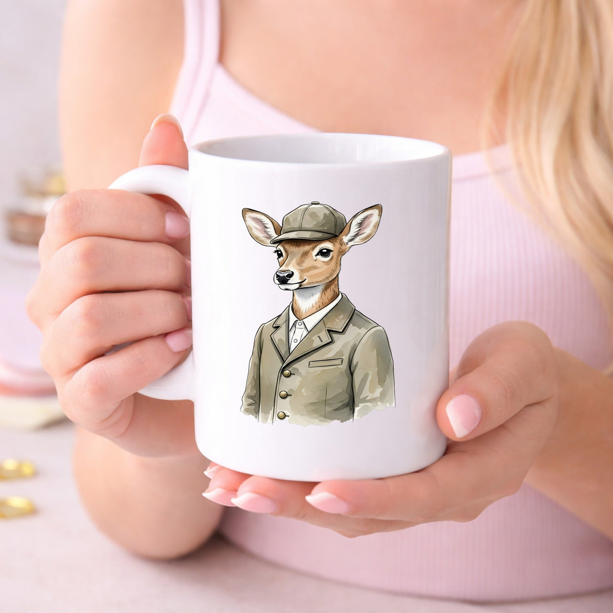 Deer In Tweed Cap Jacket UV DTF sticker applied to a white coffee mug held in both hands