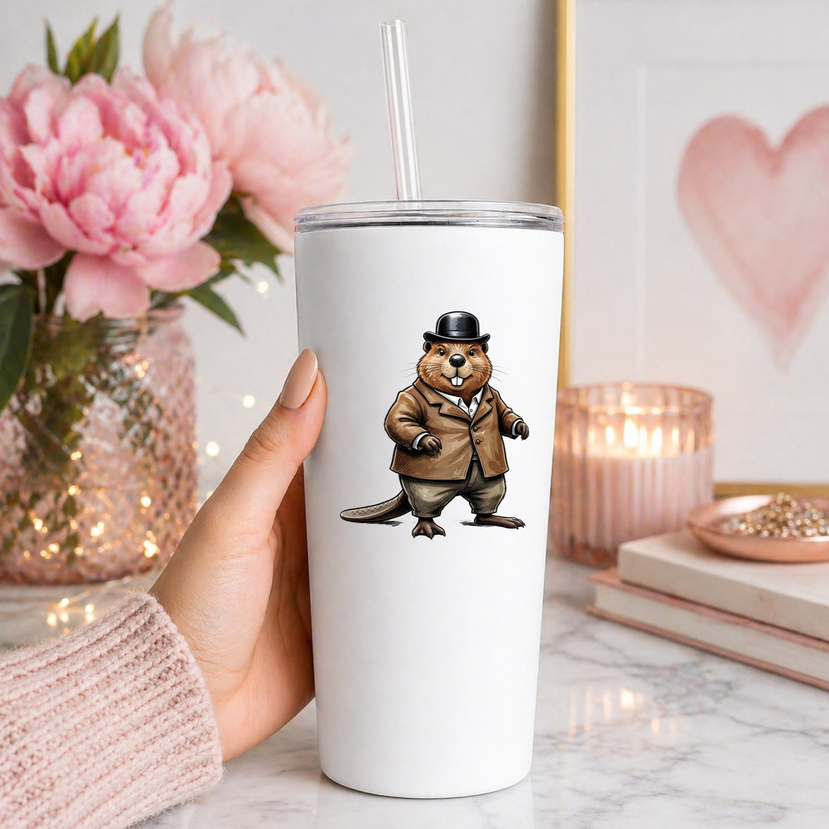 Beaver In Bowler Hat UV DTF sticker applied to a white straw tumbler beside pink peonies
