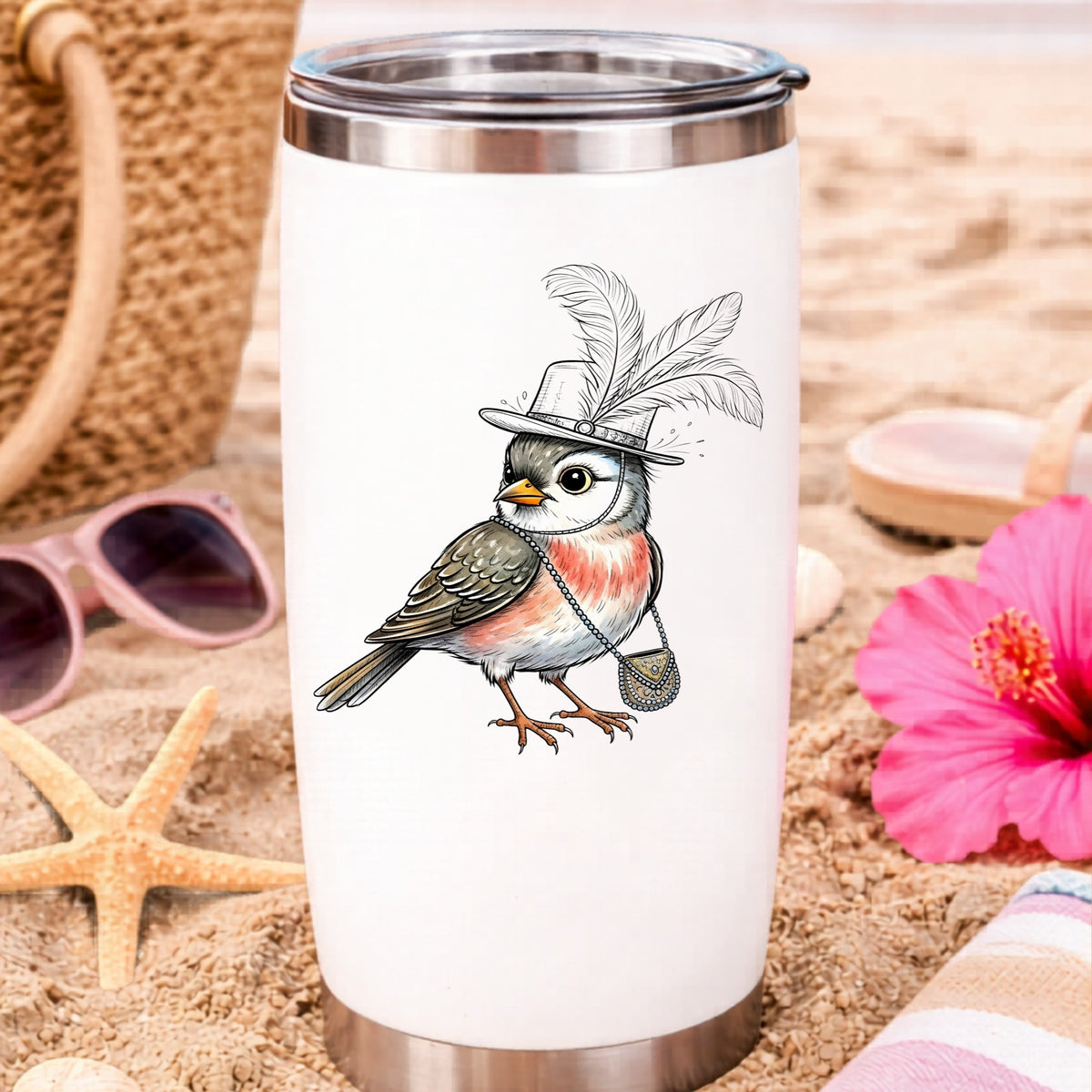 Fancy Bird Feather Hat Purse UV DTF sticker applied to a white travel tumbler on beach sand