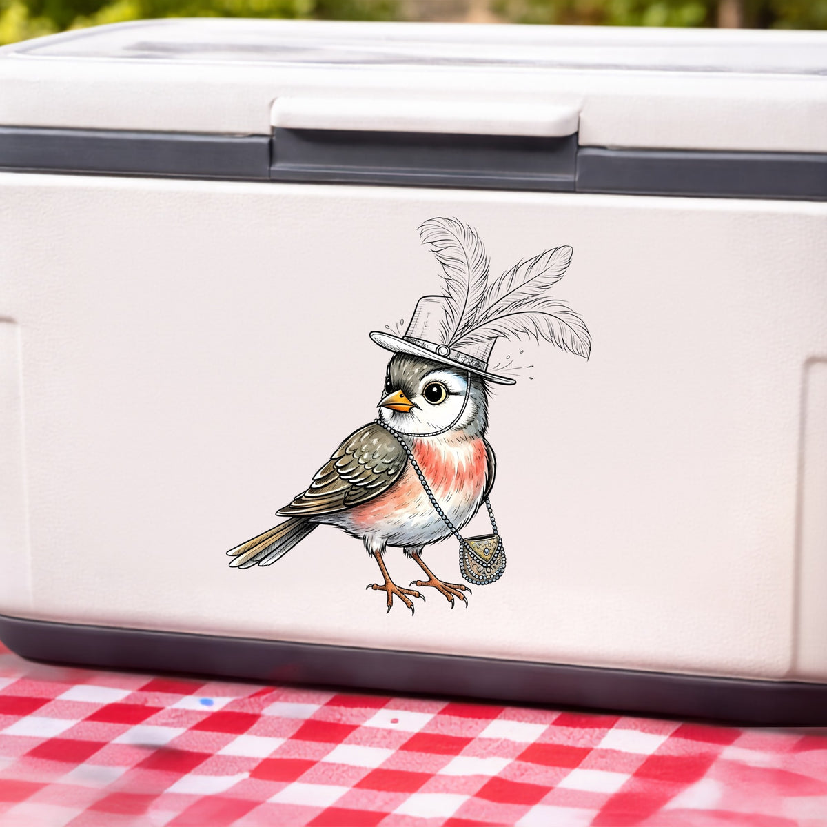 Fancy Bird Feather Hat Purse UV DTF sticker applied to a white cooler on a red gingham cloth