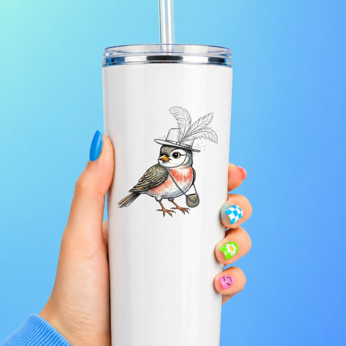 Fancy Bird Feather Hat Purse UV DTF sticker applied to a white straw tumbler on a blue background
