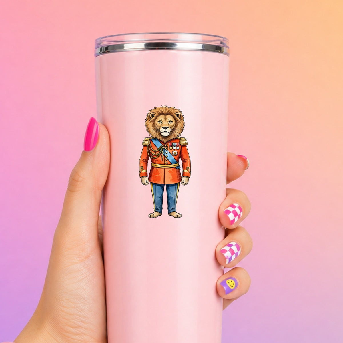 Lion Red Military Uniform UV DTF sticker applied to a tall pink tumbler on a pink and orange background